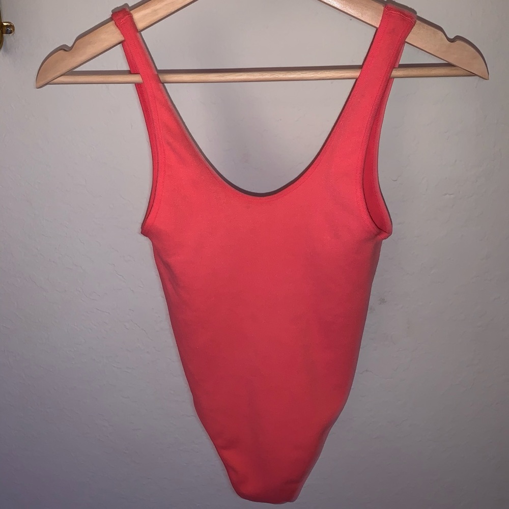 Hot pink body suit